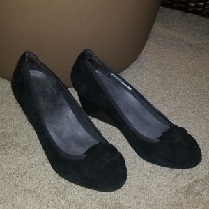 Black flats with floral ruffle